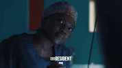 the resident smile GIF