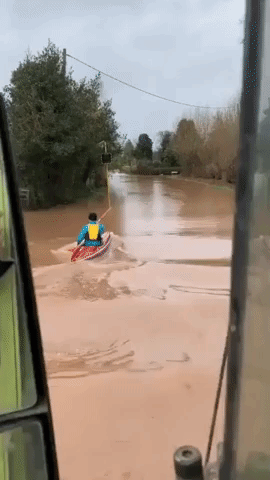 Kayaker Paddles Down Flooded Road in England Following Storm Dennis