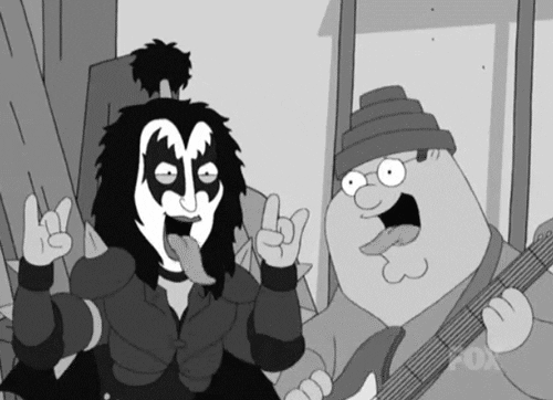 Family Guy gif. Gene Simmons of Kiss and Peter Griffin stick out their tongues and hold up rock 'n' roll hand sign.