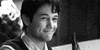 Movie gif. Joseph Gordon-Levitt as Tom in 500 Days of Summer smiles while raising and tilting his beer bottle to cheers.