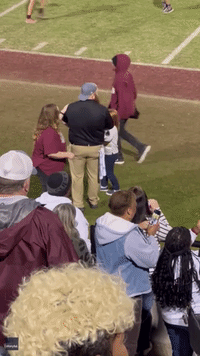 High School Football Team Goes Wild After Coach Proposes to Girlfriend Amid Victory Celebrations