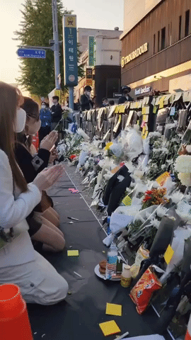 Mourners Gather and Lay Flowers Beside Scene of Catastrophic Crowd Crush in Seoul