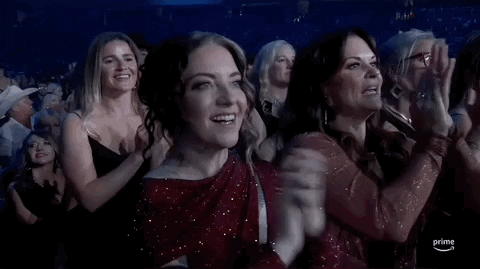 TV gif.  Closeup of a few audience members applauding at the 2024 ACM awards