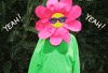 Video gif. Person in sunglasses dressed head-to-toe in a colorful flower costume. They toss their arms as the word "Yeah!" appears. The humanoid flower then multiplies into three flowers, flexing a bicep in unison. Text flashes, "You Did It"
