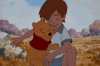 Cartoon gif. Christopher Robin and Winnie the Pooh embrace each other in a warm hug.