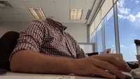 'Headless' Man Works At His Desk