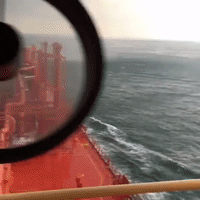 Whirlwind Whips Up Water Next to Ship