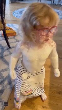 Toddler Waddles Into Kitchen Wearing 'Penguin Dress' Made With Diaper Cream