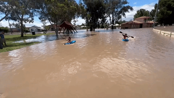 Children Kayak in Flooded Gunnedah Park After Days of Heavy Rain Hits New South Wales