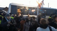 Ukrainian Refugees Line Up for Buses at Poland's Medyka Border Crossing