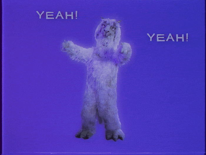 Video gif. Person in a llama suit dances excitedly in font of a blue background with their hands in the air. Text, “Yeah! Yeah! Yeah!”