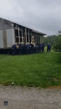 Amish Men Unite to Manually Move Building