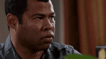 TV gif. Jordan Peele in Key and Peele stares unblinkingly to the side as sweat pours profusely down his face. A steady stream drips off his eyebrow. 