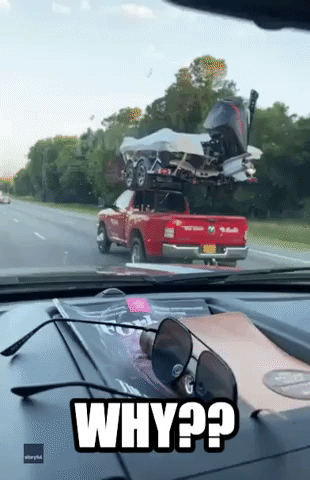 Boat Mounted on Truck's Roof Baffles Driver