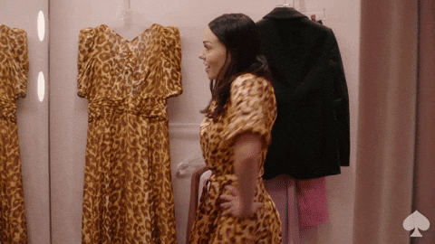A woman is posing in a cheetah print dress with the word "FABULOUS" written below.