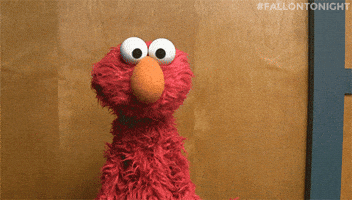 TV gif. Elmo from Sesame Street tilts his head and shrugs as if to say, I dunno.