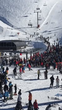 Workers Rescue Young Boy Dangling from Ski Lift