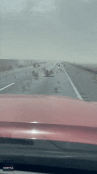 Tumbleweeds Bounce Across Hazy Nevada Highway
