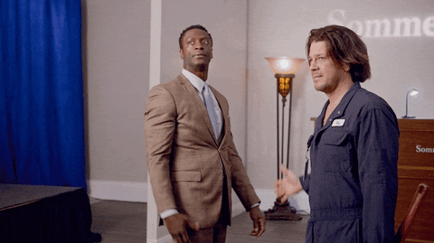 TV gif. Aldis Hodge as Alec and Christian Kane as Eliot on Leverage high five twice and then fist bump in cool celebration, while not even looking at each other to signify how cool they are. 