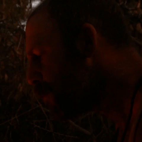 eating fresh cooked meat in the wild