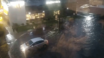 Cars Drive Through Inundated Roads After Downpour Brings Flash Flooding to Chicago
