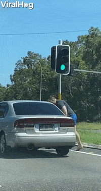 Angry Man Attacks Car At Intersection GIF by ViralHog