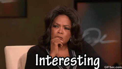Celebrity gif. Oprah in the Thinker position, listening, narrowing her eyes. Text, "interesting"