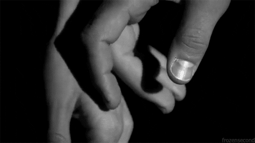 black and white holding hands GIF