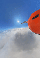 Skydiver Falling Through Cloud