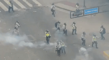 Protesters use Makeshift Shields to Face Off Against National Guard Tear Gas