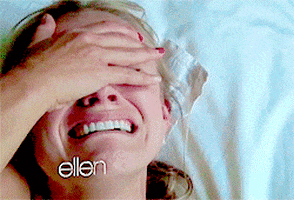 Celebrity gif.  A video of Kristen Bell crying over a sloth is being shown on the Ellen show.