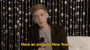 TV gif. Teen boy on New Year's Rockin' Eve points at us as he talks into a microphone, saying, "Have an amazing new year. And remember to be yourself because you is great."