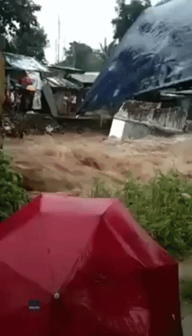 Floodwaters Sweep Away House as Typhoon Rai Pummels Philippines