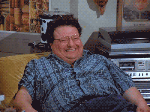 Seinfeld gif. Wayne Knight as Newman leans back on a sofa and laughs maniacally.