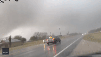 Massive Funnel Cloud Moves Across Texas Highway Amid Tornado Watch