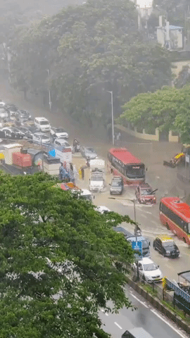 Mumbai Drivers, Pedestrians Brave Monsoon Floods