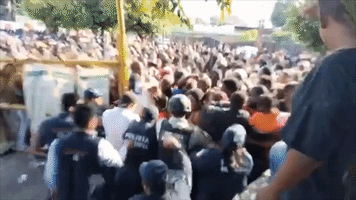 Migrants Rush Asylum Office in Southern Mexico as Thousands Wait in Line