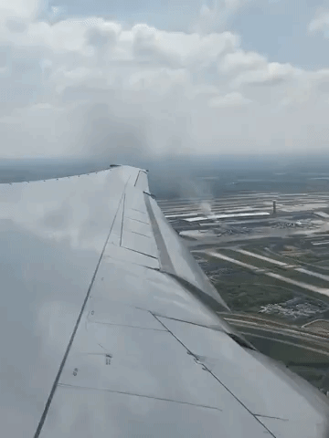 Smoke Plume Seen From Airplane as Bus Reportedly Burns at Charles de Gaulle Airport