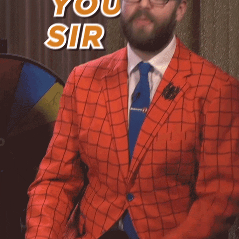 TV gif. Greg Miller from Kinda Funny leans back as he points a finger. Text, "Thank You Sir."