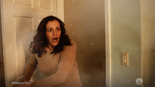 TV gif. Athena Karkanis as Grace in Manifest. She runs into a room that's caught on fire and her face contorts in shock as she takes in all the smoke and flame.