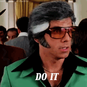 Movie gif. Ben Stiller as David in Starsky and Hutch sports a disco look with oversized tortoise shell sunglasses, mutton chops, and a butterfly collar shirt. He looks to the side as he raises his eyebrows and utters, "Do it."