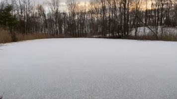 'The Sound Is the Coolest!': Woman Delights in Tossing Rocks Across Frozen Pond in Vermont