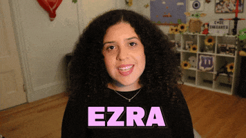Video gif. Shalymar Rivera Gonzalez smiles at us and says, “Ezra Miller.”