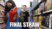 Video gif. A young man walks down a grocery store isle and tilts his head as if annoyed. Text, "Final straw."