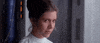 Movie gif. Carrie Fisher, as Princess Leia in Star Wars, reacts with a demure, pleased smile.