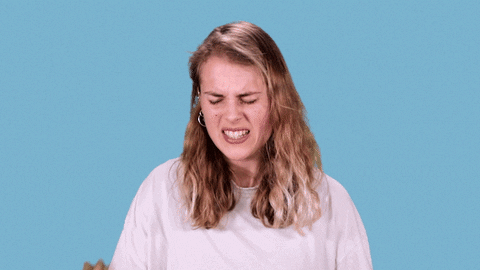Celebrity gif. Marika Hackman winces and face-palms herself.