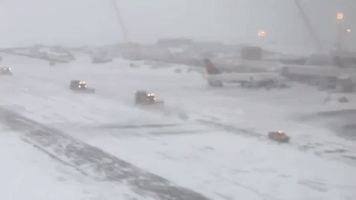 Snow Plows Clear Runways at Denver International Airport