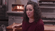 Reality TV. Standing in a kitchen, Farideh Sadeghin from Munchies raises her eyebrows and lifts one side of her mouth, nodding as if to say, “Oh yeah.”