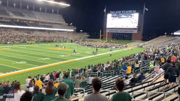Baylor Fans Rush Field to Celebrate College Basketball Championship Win
