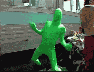 green man happy dance GIF
